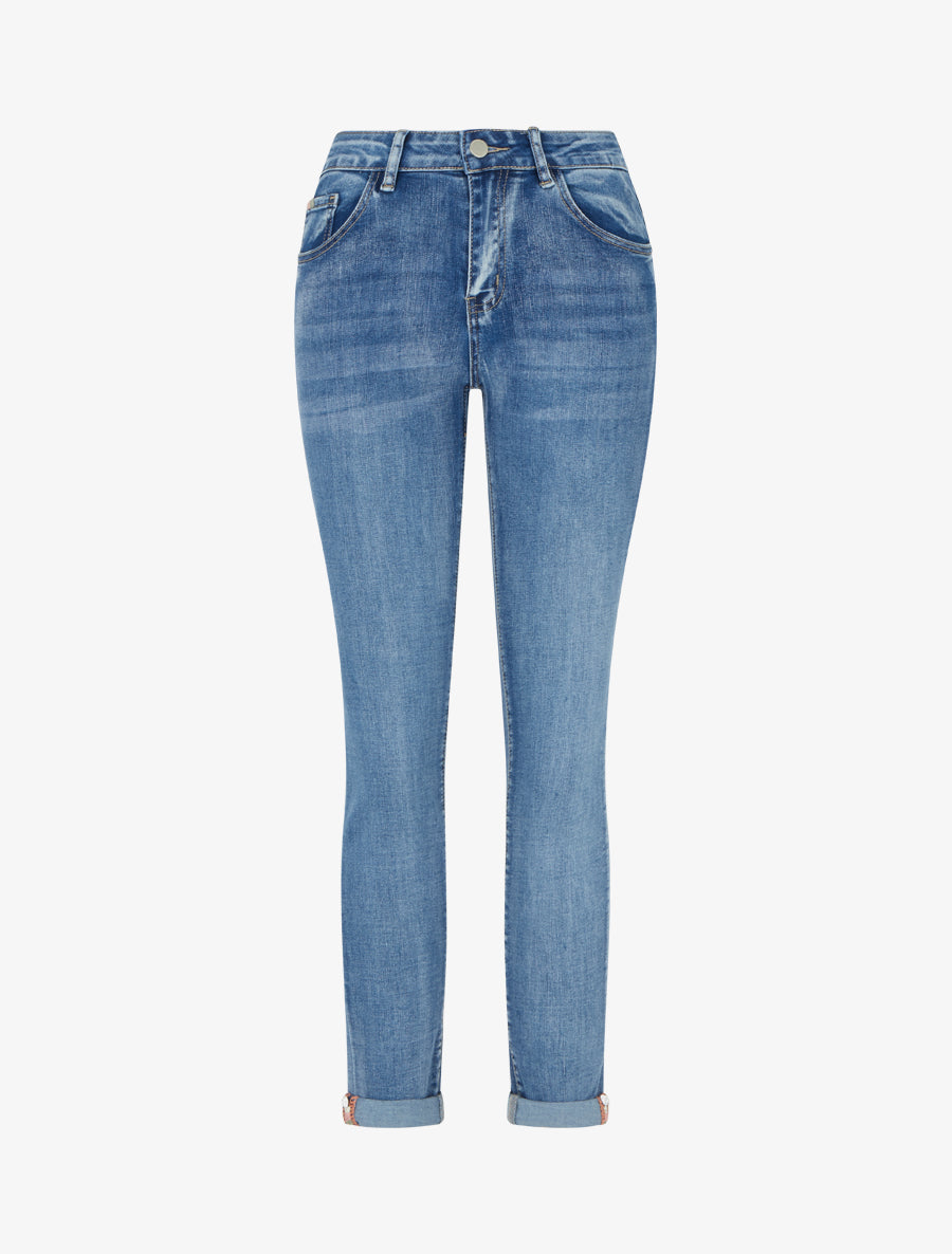 Skinny-Jeans mit Schmucksäumen und Gürtel - Blau