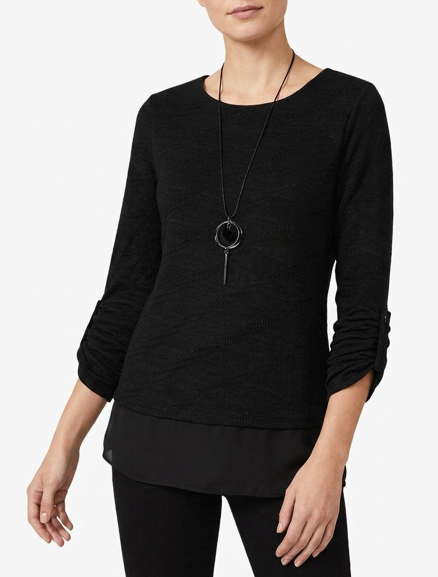 Texturierter Pullover mit Rundhalsausschnitt und sichtbarem Futter. - Schwarz