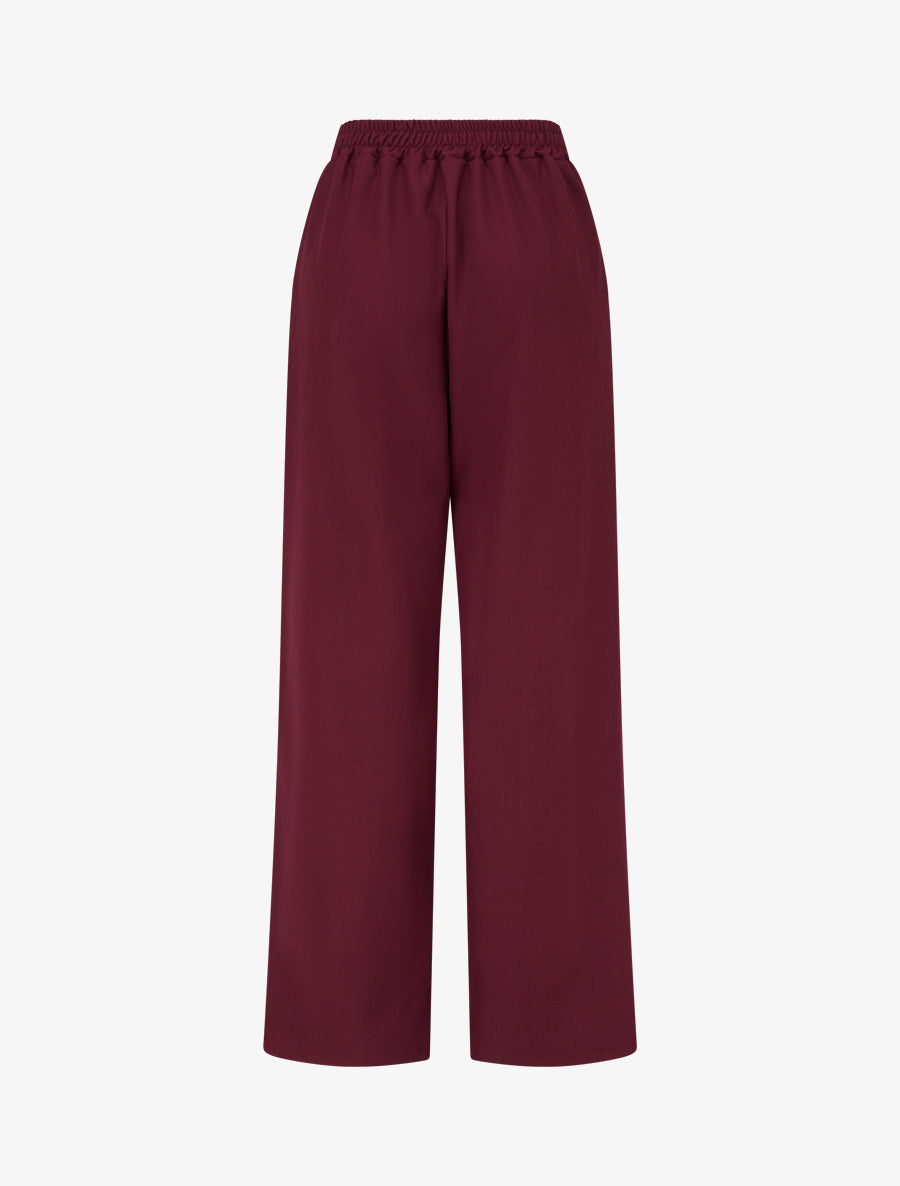 Weit geschnittene Hose mit hoher Taille und Schmuckverzierung. - Weinrot