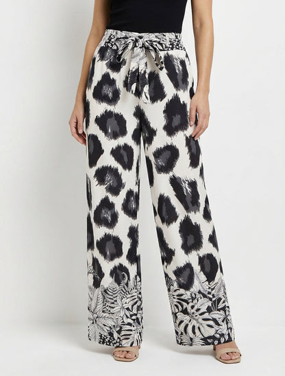 Weit geschnittene Hose mit fantasievollem Leopardenmuster - Schwarz